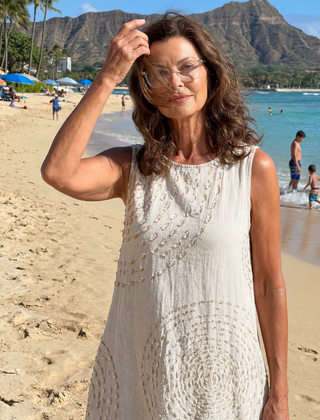 White textured midi dress, sleeveless with round neckline and gathered waist