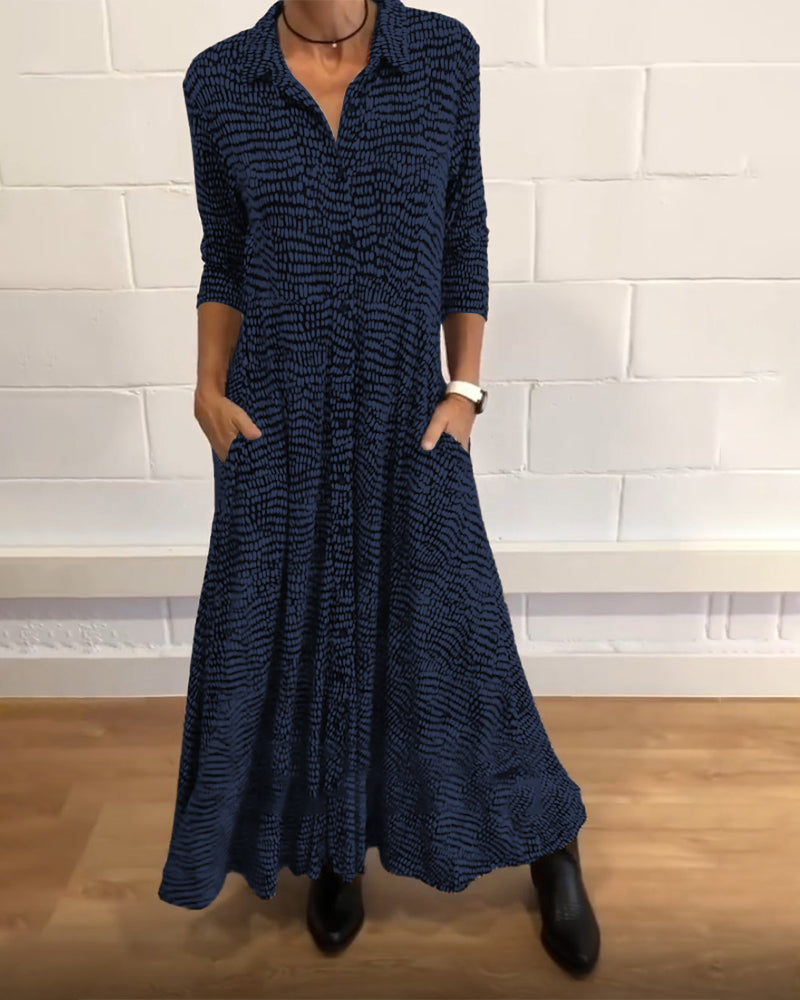Blue patterned midi dress with V-neck, three-quarter sleeves, side pockets