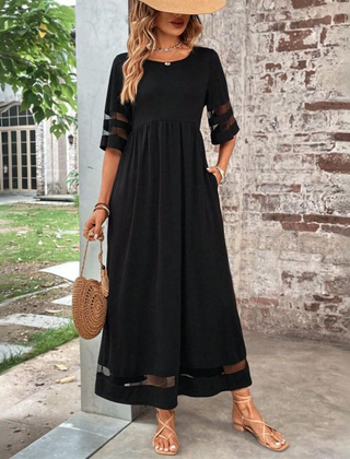 Black midi dress with gathered waist and contrast stripe hem detail.