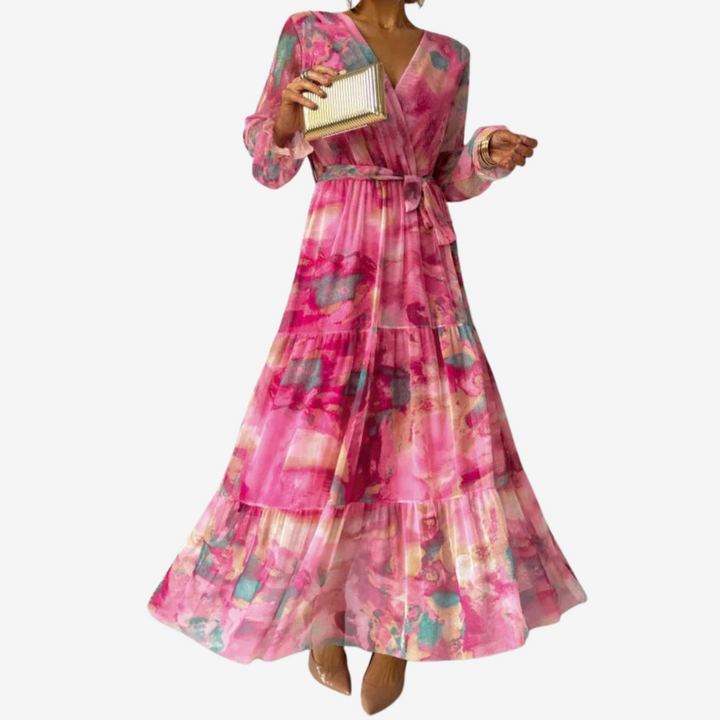 Pink floral tiered dress with V-neck, long bell sleeves, and cinched waist belt
