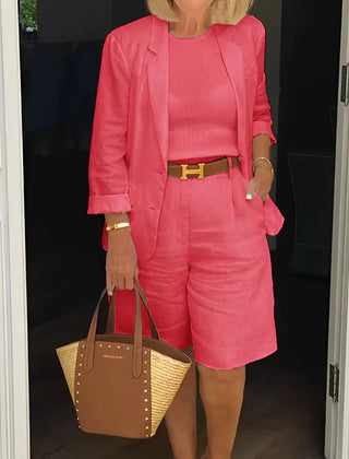 Red two-piece suit set with cropped blazer and matching shorts