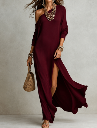 Burgundy one-shoulder maxi dress with long sleeve and high side slit, flowing hem.