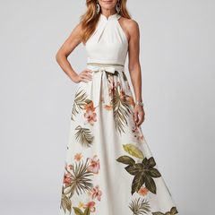 White draped halter botanical maxi dress with gathered waist and flowing skirt