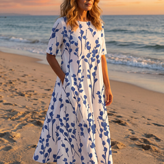White floral midi dress with short sleeves and gathered skirt, front view