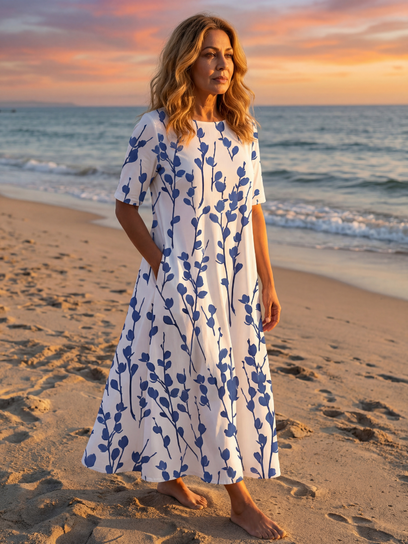 White floral midi dress with short sleeves and gathered skirt, front view