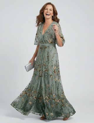 Sage green halter V-neck maxi dress with floral print, short sleeves and flowing tiered skirt