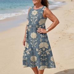 Blue sleeveless midi dress with large cream flower and vine pattern
