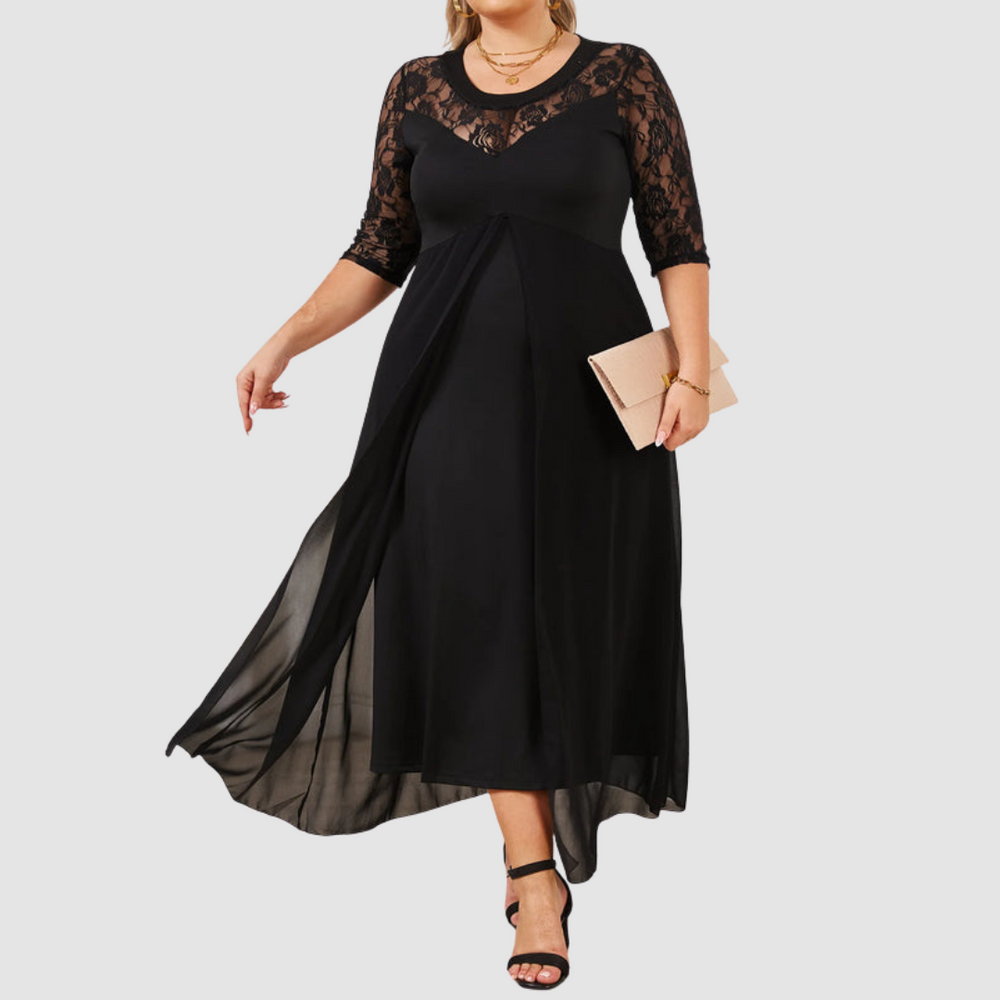 Long lace dress, black fitted bodice with lace sleeves and flowing flared skirt