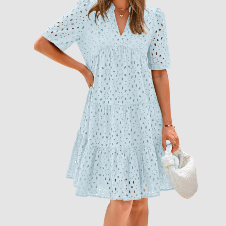 Light blue V-neck tiered babydoll summer dress, short sleeves, dotted pattern.