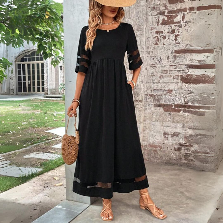 Black A-line midi dress with short sleeves, sheer stripe trim and tiered skirt