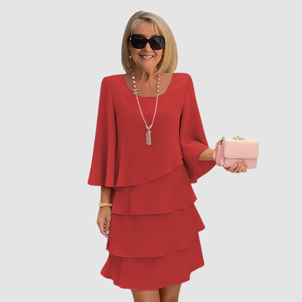 Red layered short dress with long sleeves and scoop neckline, tiered skirt.