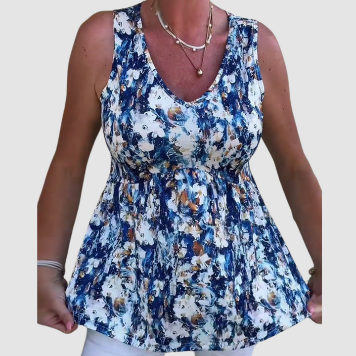 Women’s sleeveless V-neck patterned top with ruched waist, blue and white tones
