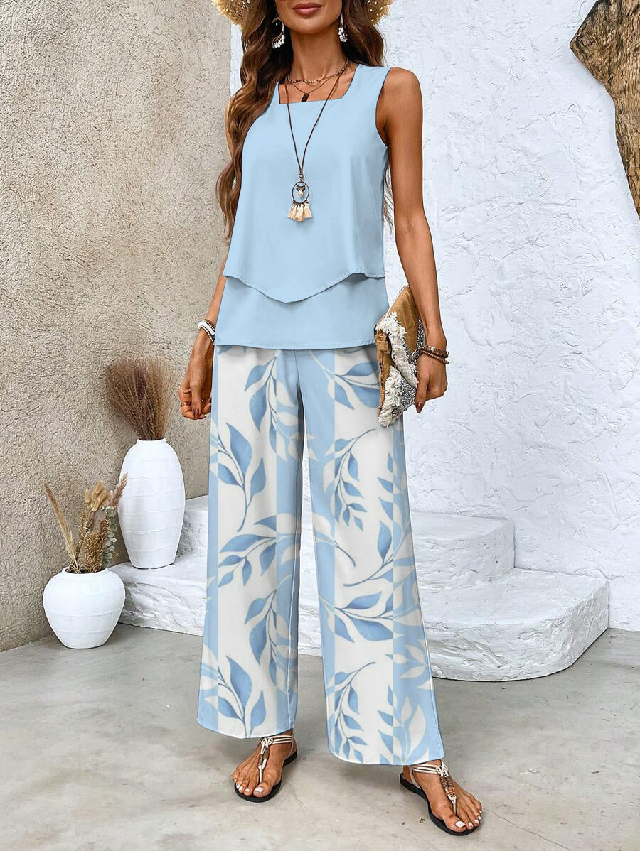 Light blue sleeveless layered top and wide-leg pants with leaf print