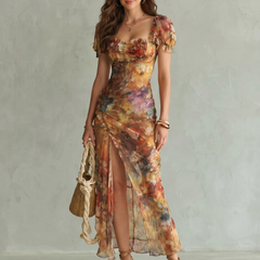 Multicolor ruched midi dress with ruffled sleeves and front slit, floral pattern.