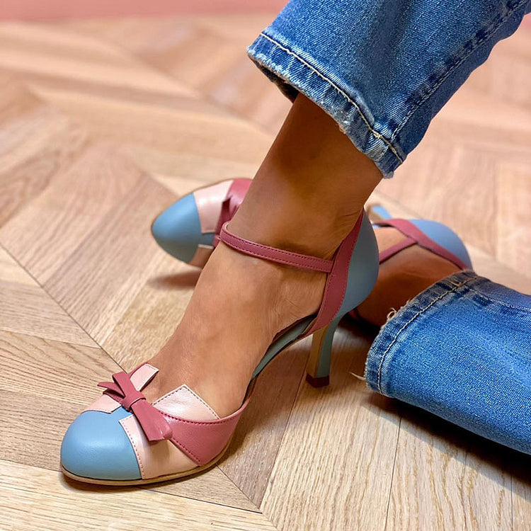 Pink-and-blue Mary Jane orthopedic heels with ankle strap and bow detail