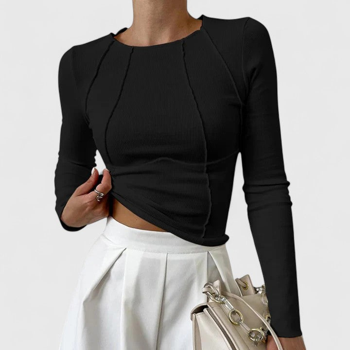 Black long-sleeve knit top with crew neck and draped ruched front; fitted cropped hem