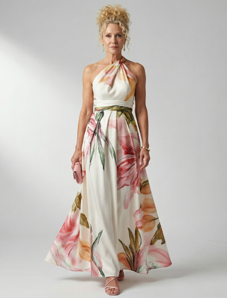 Light floral maxi dress with halter neck, pink and green flowers on a cream base