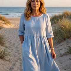 Light blue midi dress with round neck, three-quarter sleeves, gathered waist