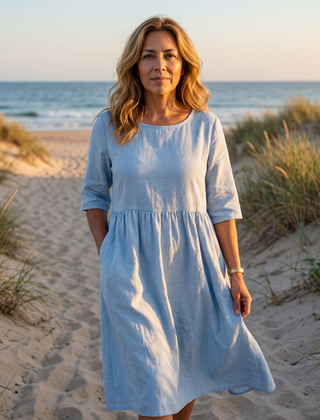 Light blue midi dress with round neck, three-quarter sleeves, gathered waist