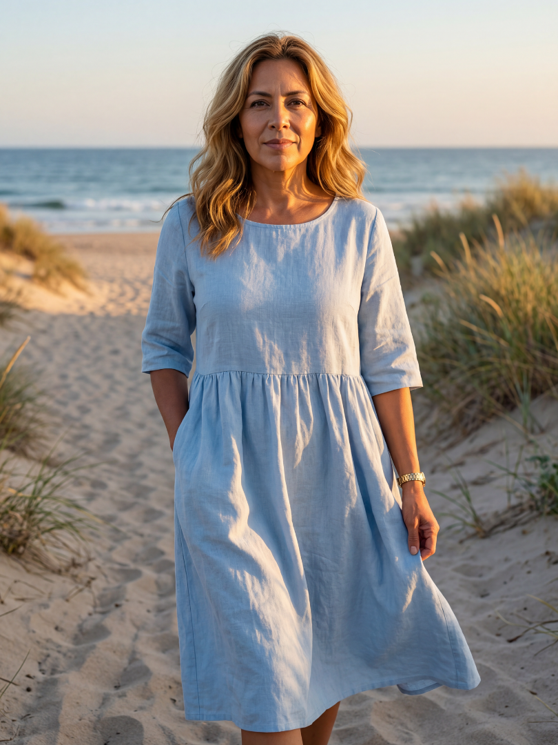 Light blue midi dress with round neck, three-quarter sleeves, gathered waist