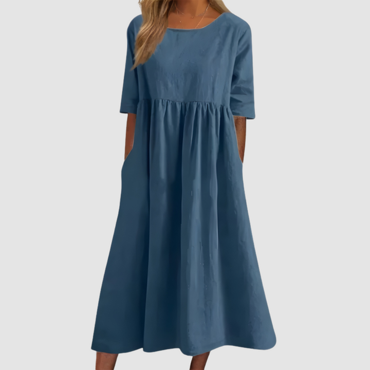 Blue breezy dress with smocked/gathered waist and short sleeves, full A-line shape