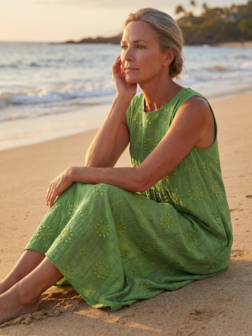 Green sleeveless midi dress with floral embroidery, relaxed fit, tiered skirt