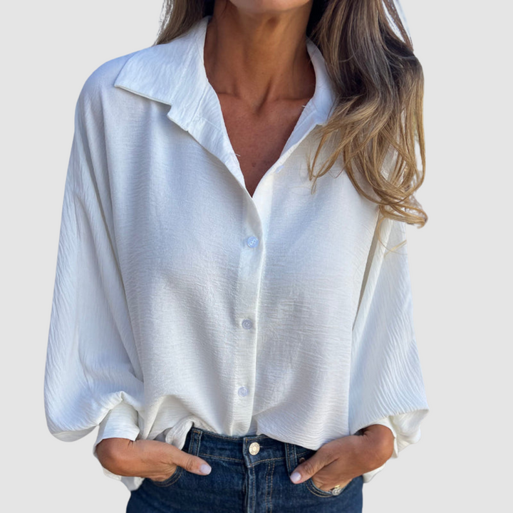 Light blue oversized button-front blouse with spread collar, long sleeves