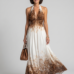 Pleated halter midi dress in white with brown leopard print panels and flowing skirt