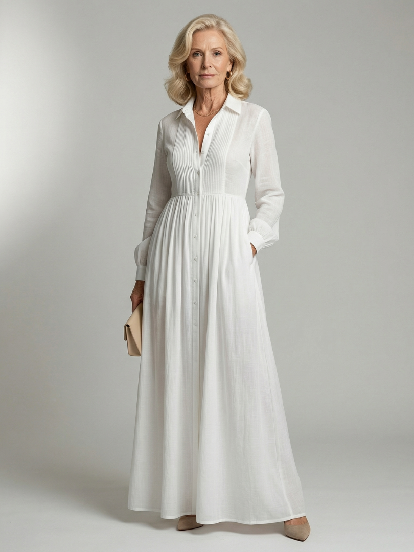 White soft flow maxi dress with V-neck, long sleeves, button front and gathered waist