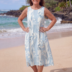 Sky blue leaf print midi dress with sleeveless round neckline and gathered waist