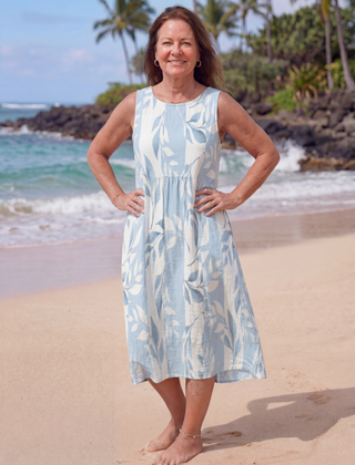 Sky blue leaf print midi dress with sleeveless round neckline and gathered waist
