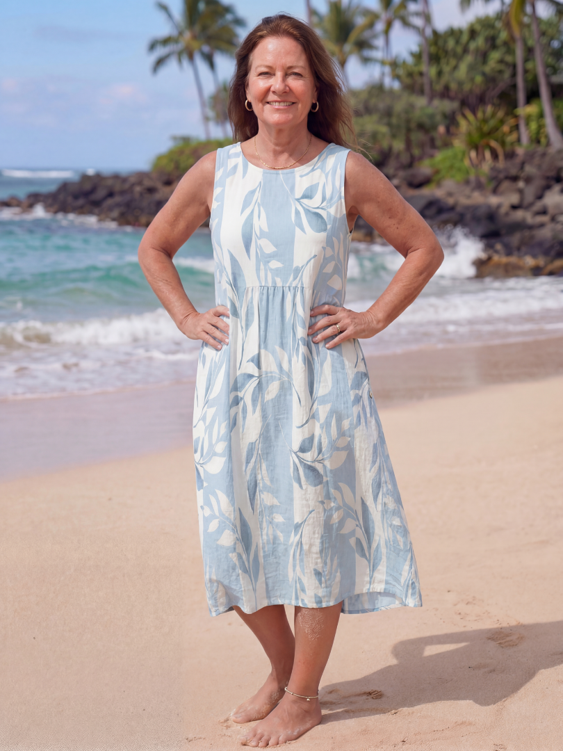 Sky blue leaf print midi dress with sleeveless round neckline and gathered waist