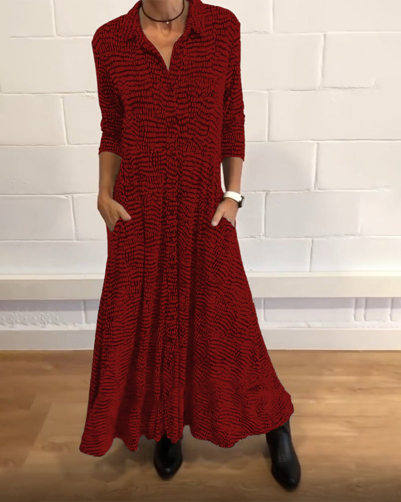Red patterned midi dress with V-neck, three-quarter sleeves, side pockets