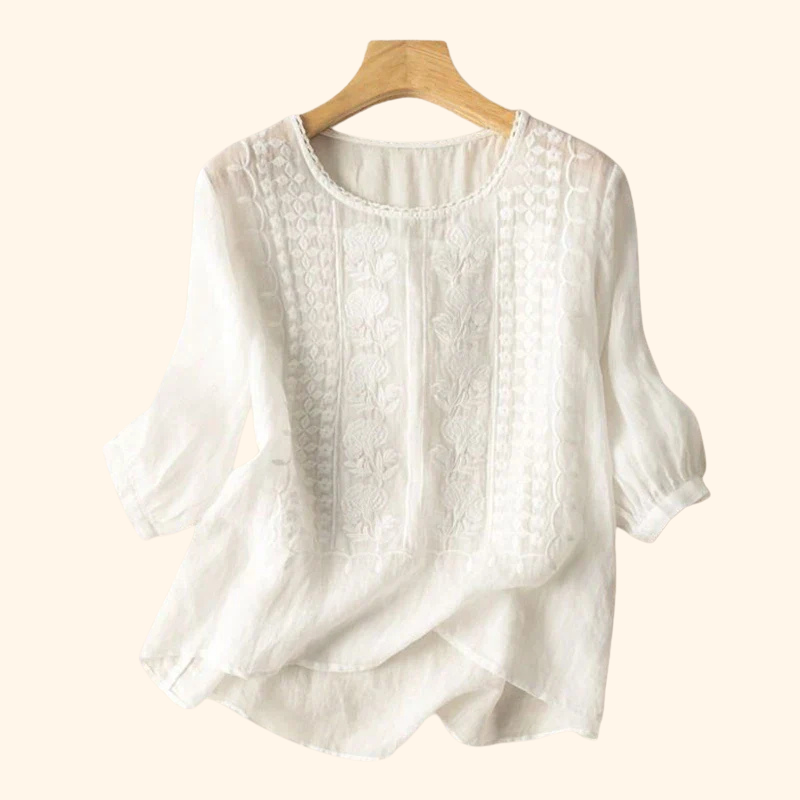 White embroidered soft blouse with round neck, vertical pintuck panels, puff sleeves