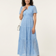 Sky blue V-neck tiered midi dress with short sleeves and textured eyelet dot pattern