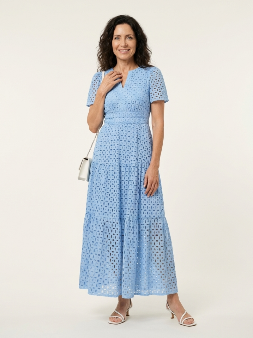 Sky blue V-neck tiered midi dress with short sleeves and textured eyelet dot pattern
