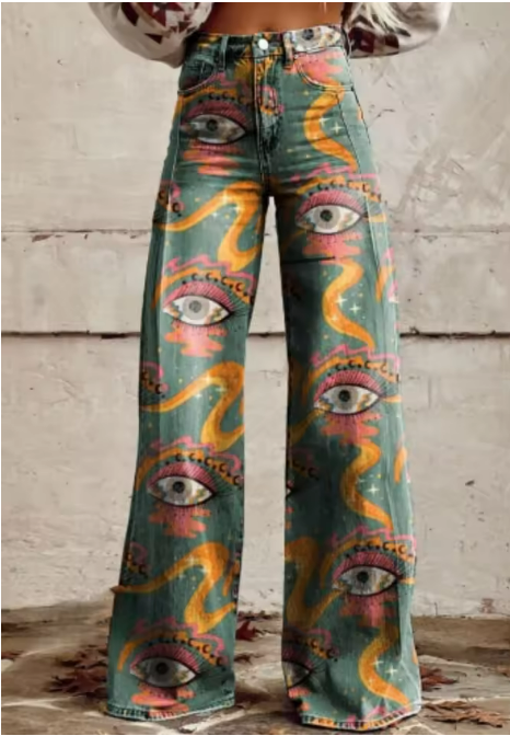 Boho vintage jeans with all-over eye graphic print and wide, flared legs