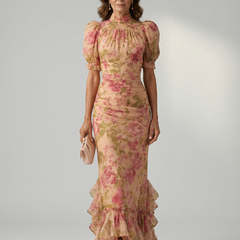Floral pink high-neck maxi dress with puff sleeves and tiered ruffle hem.