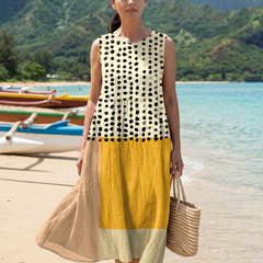 Sleeveless midi dress in cream with black dots; yellow skirt panel