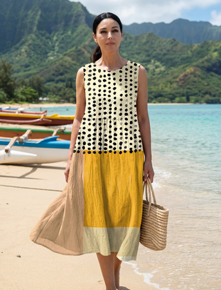 Sleeveless midi dress in cream with black dots; yellow skirt panel