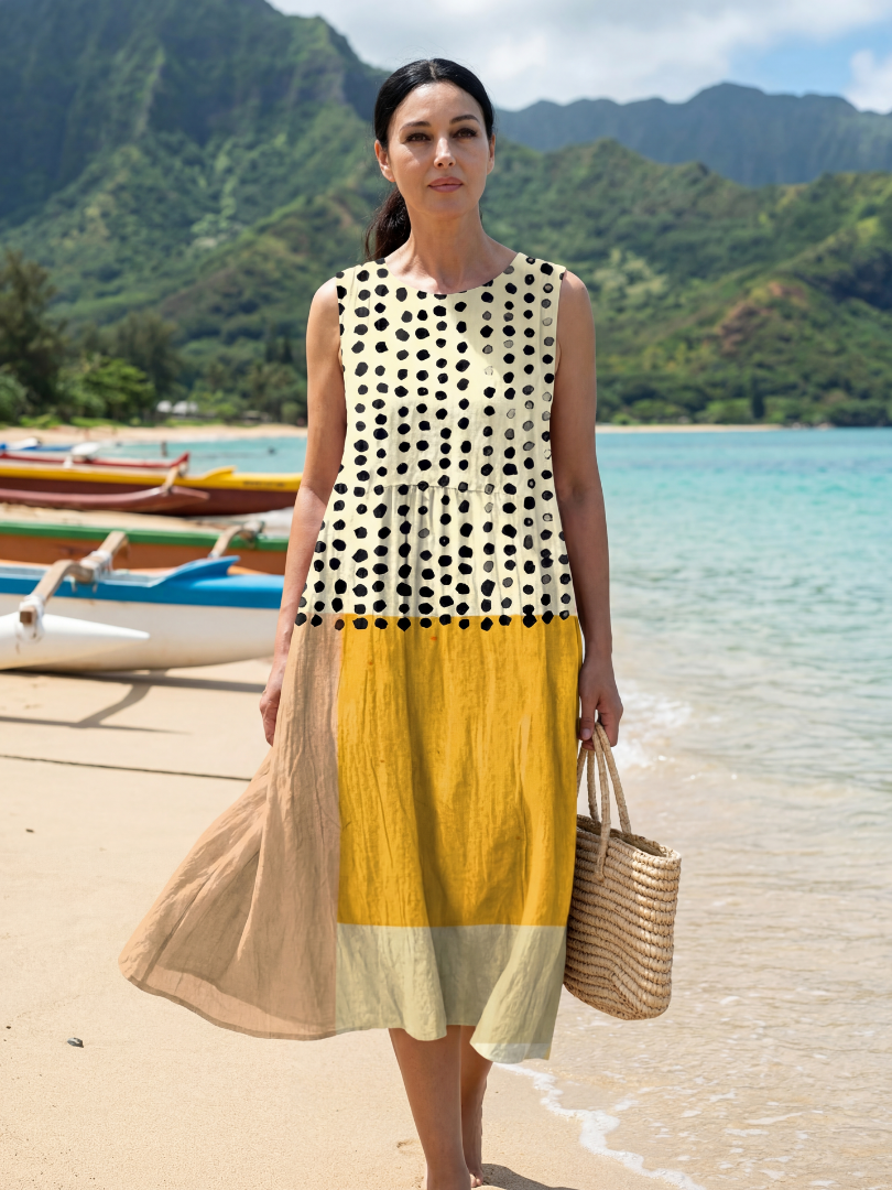 Sleeveless midi dress in cream with black dots; yellow skirt panel