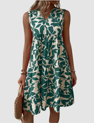 Green sleeveless V-neck flowy dress with leaf-pattern print and gathered skirt