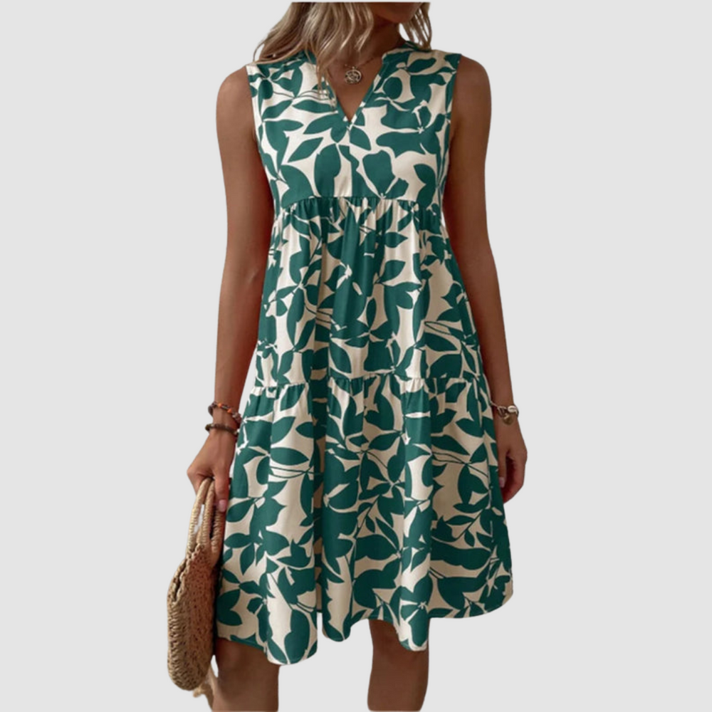 Green sleeveless V-neck flowy dress with leaf-pattern print and gathered skirt
