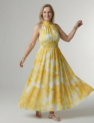Yellow halter midi dress with gathered bodice and full gathered skirt, tie-dye pattern