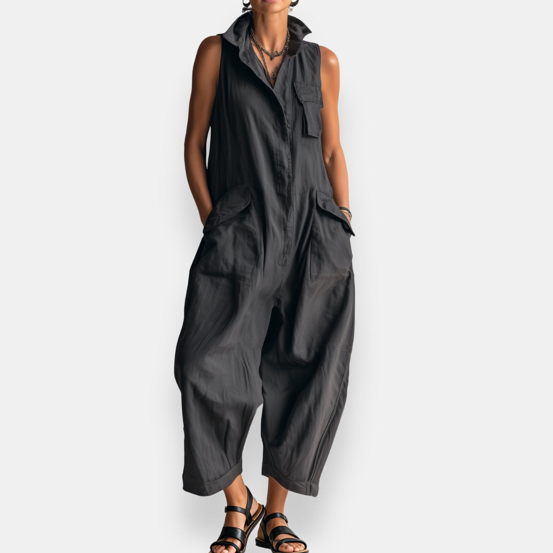 Black oversized sleeveless jumpsuit with open collar and chest patch pockets