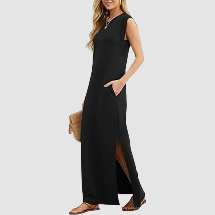 Black sleeveless maxi dress with round neckline and high side slit at hem