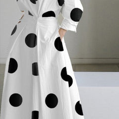 White shirt dress with black polka dots, long sleeves, collar, belted waist