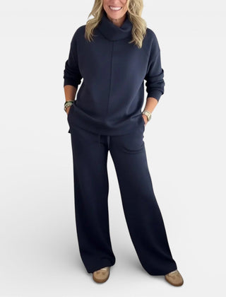 Dark navy two-piece lounge set with hooded pullover and wide-leg pants