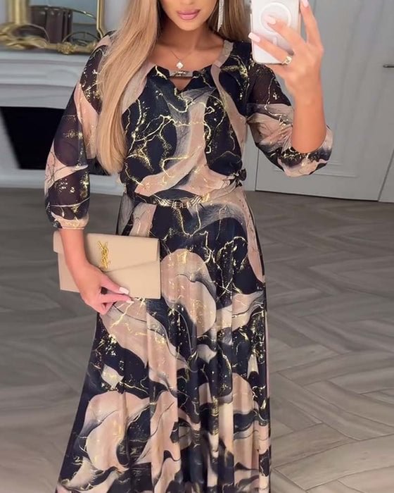 Chiffon maxi dress with navy and gold marbled print, ruffled neckline, three-quarter sleeves