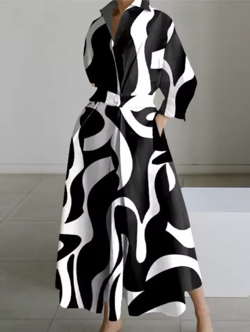 Black shirt dress with abstract white swirl pattern, long sleeves, button front